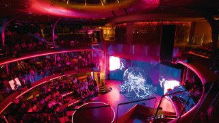 Gründung Seelive Tivoli Lila ausgeleuchtetes AIDA Theatrium